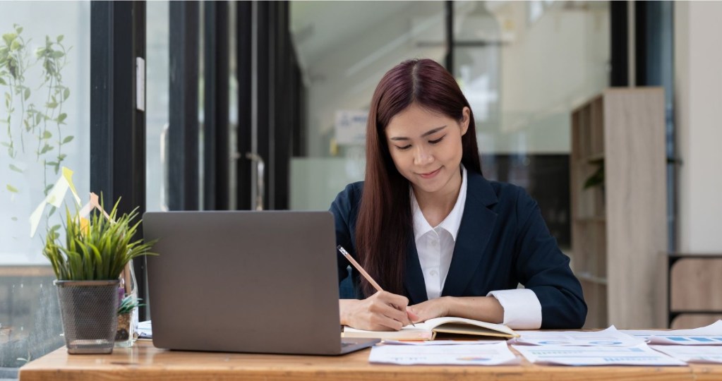 School educator preparing material using mdm installed device