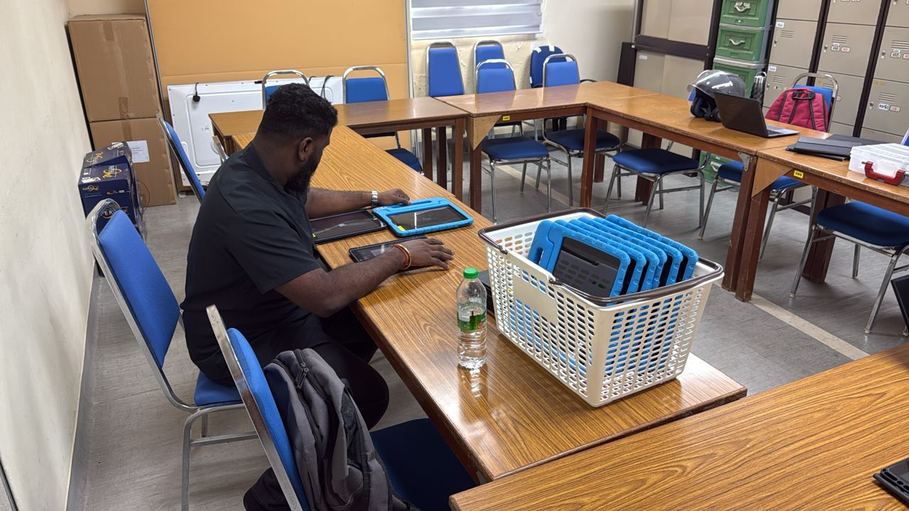 A CHN employee configuring MDM for ipad in the Japanese school of Johor